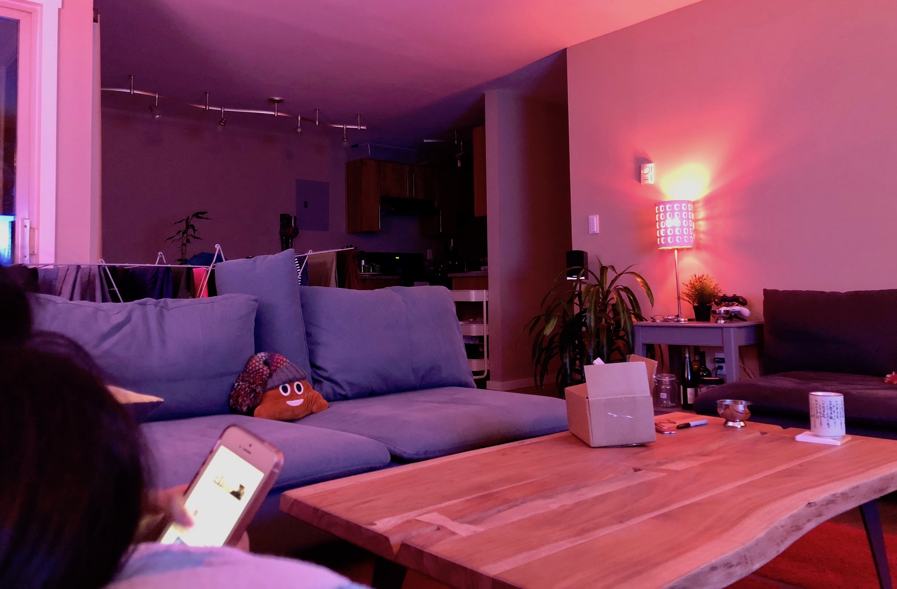 Hue lamp glow with Home app scene tiles pulled up on the iPad