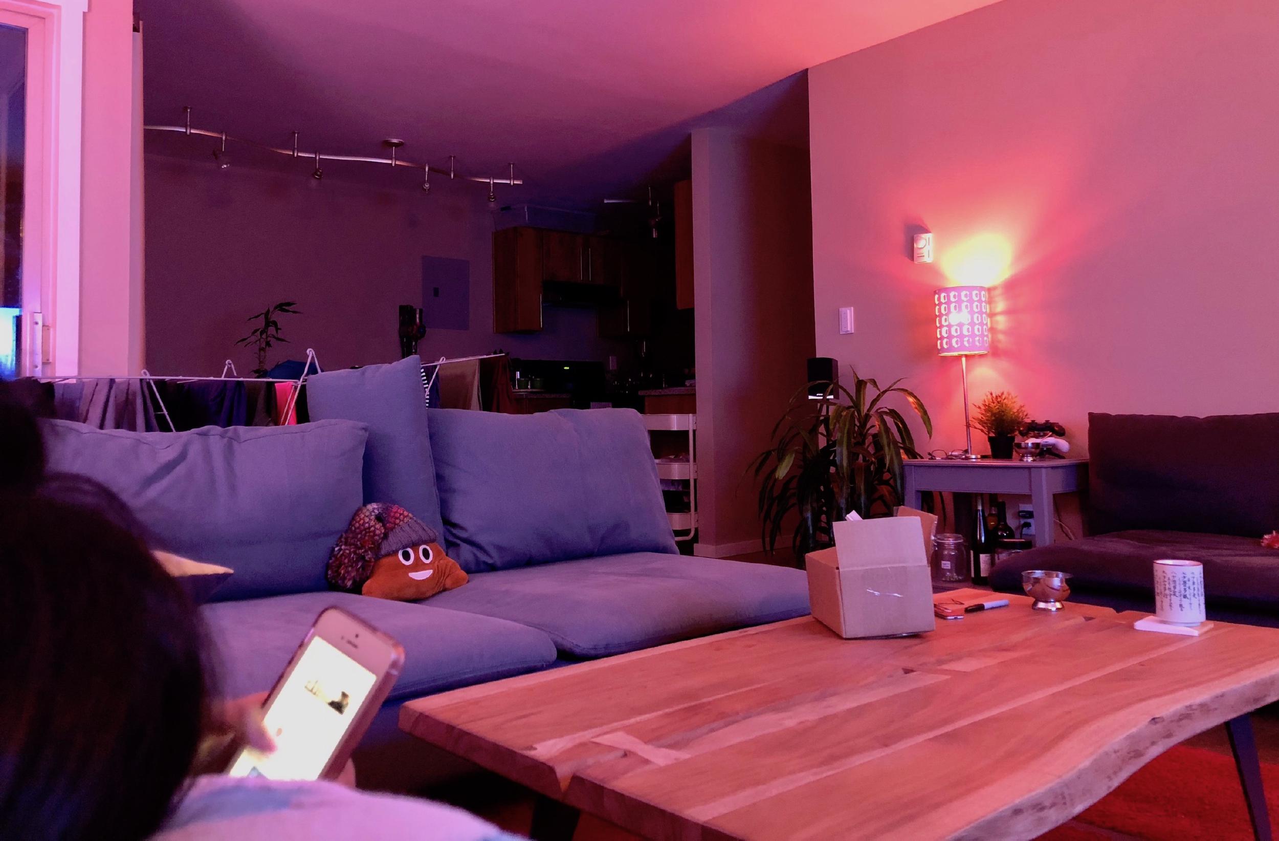 Hue lamp glow with Home app scene tiles pulled up on the iPad